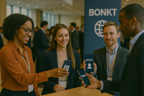 Professionals Sharing BONKT Cards at Networking Event.png